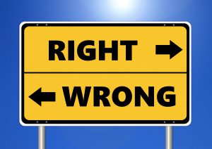 road sign saying "right" and "wrong" with arrows pointing left and right